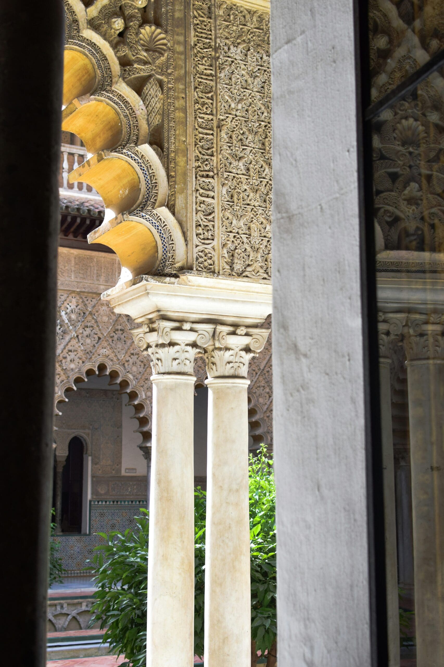Interior view of the elegant courtyard of the Seville City Hall with columns and arcades.