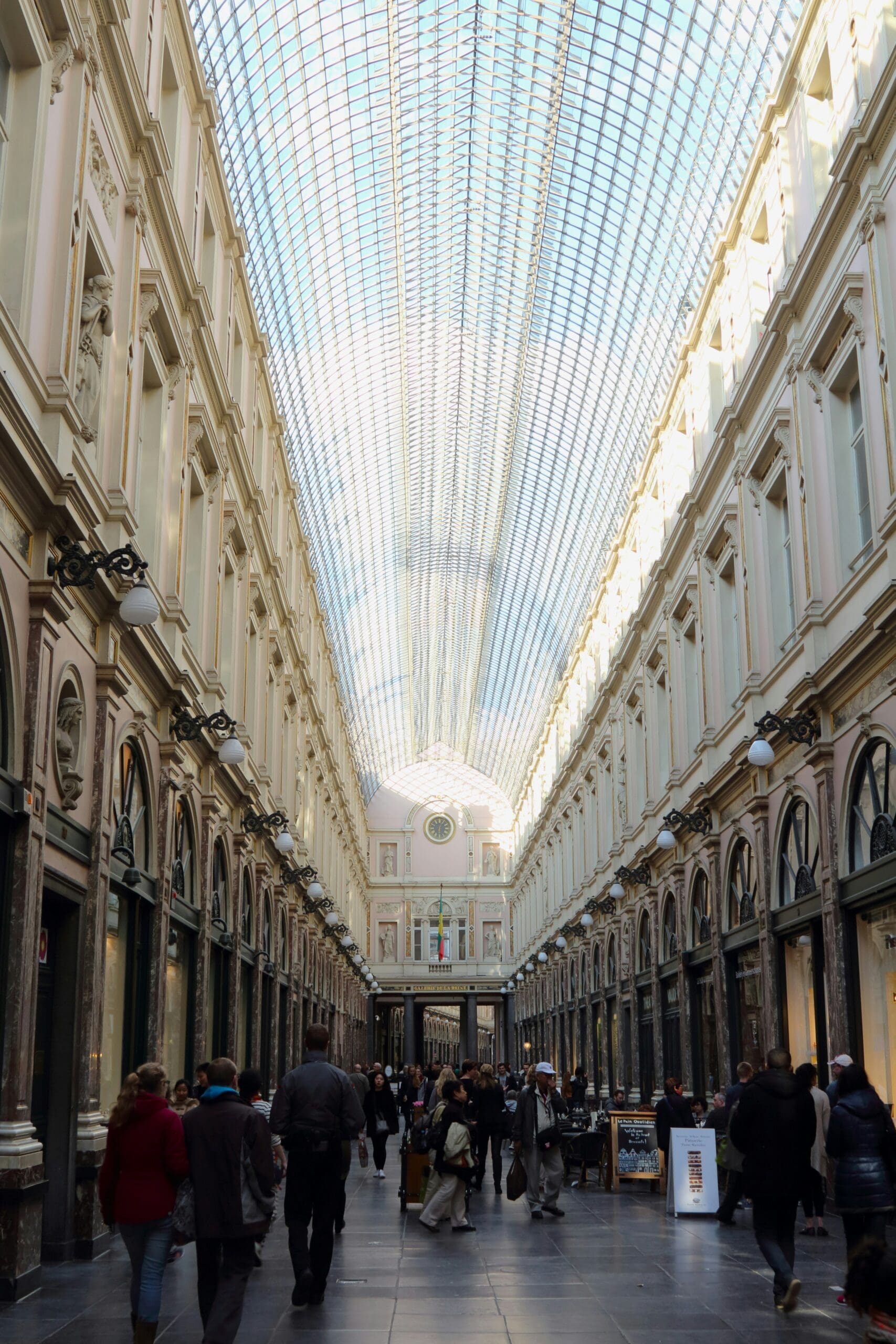 Visitors admire an impressive painting in the gallery.