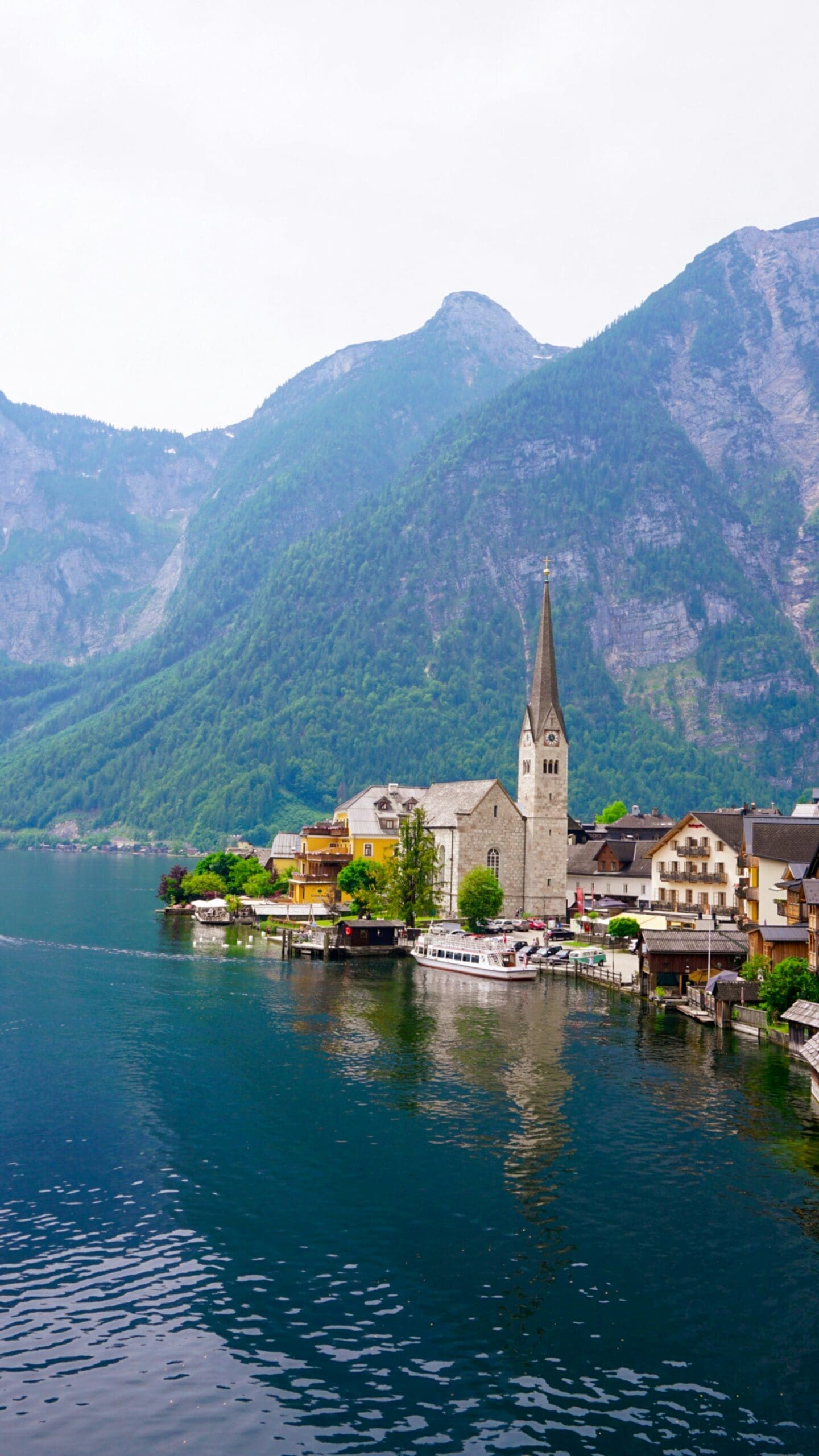 A picturesque view from the Hallstatt Skywalk, featuring mountains and a lake.