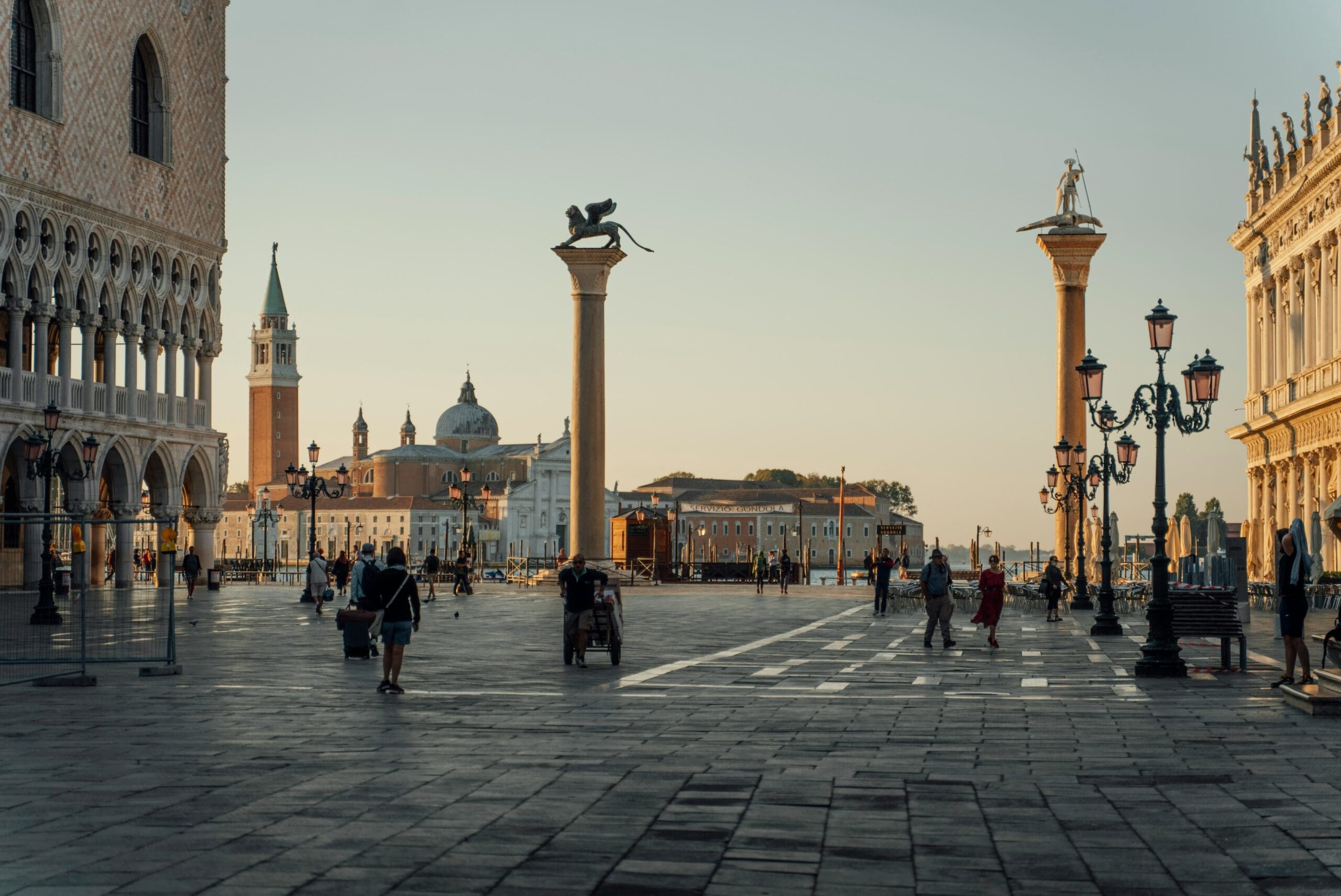 People are gathering in Piazza Maggiore for a street festival.