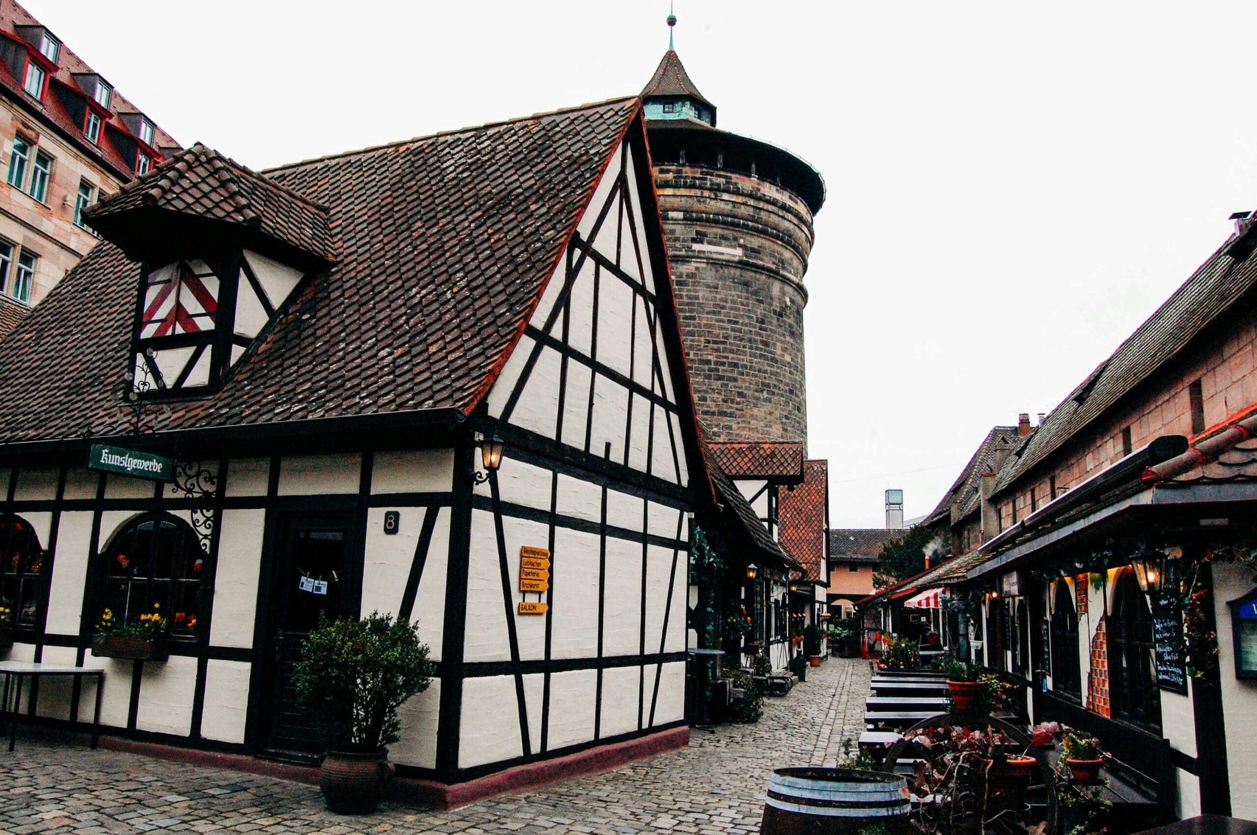 A picture of the Handwerkerhof in Nuremberg, showing traditional architecture and a bustling atmosphere