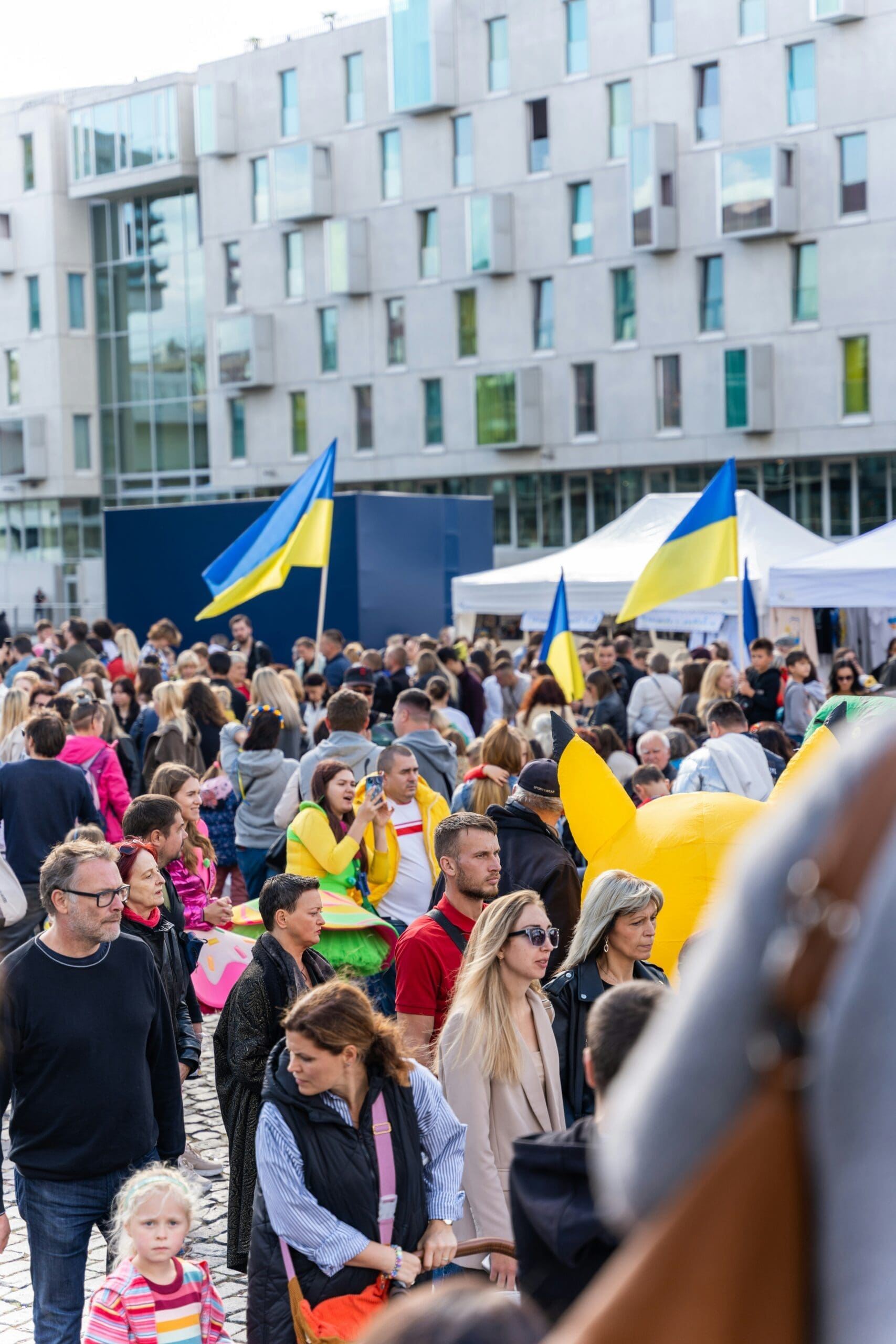 People enjoy an event at the New Square