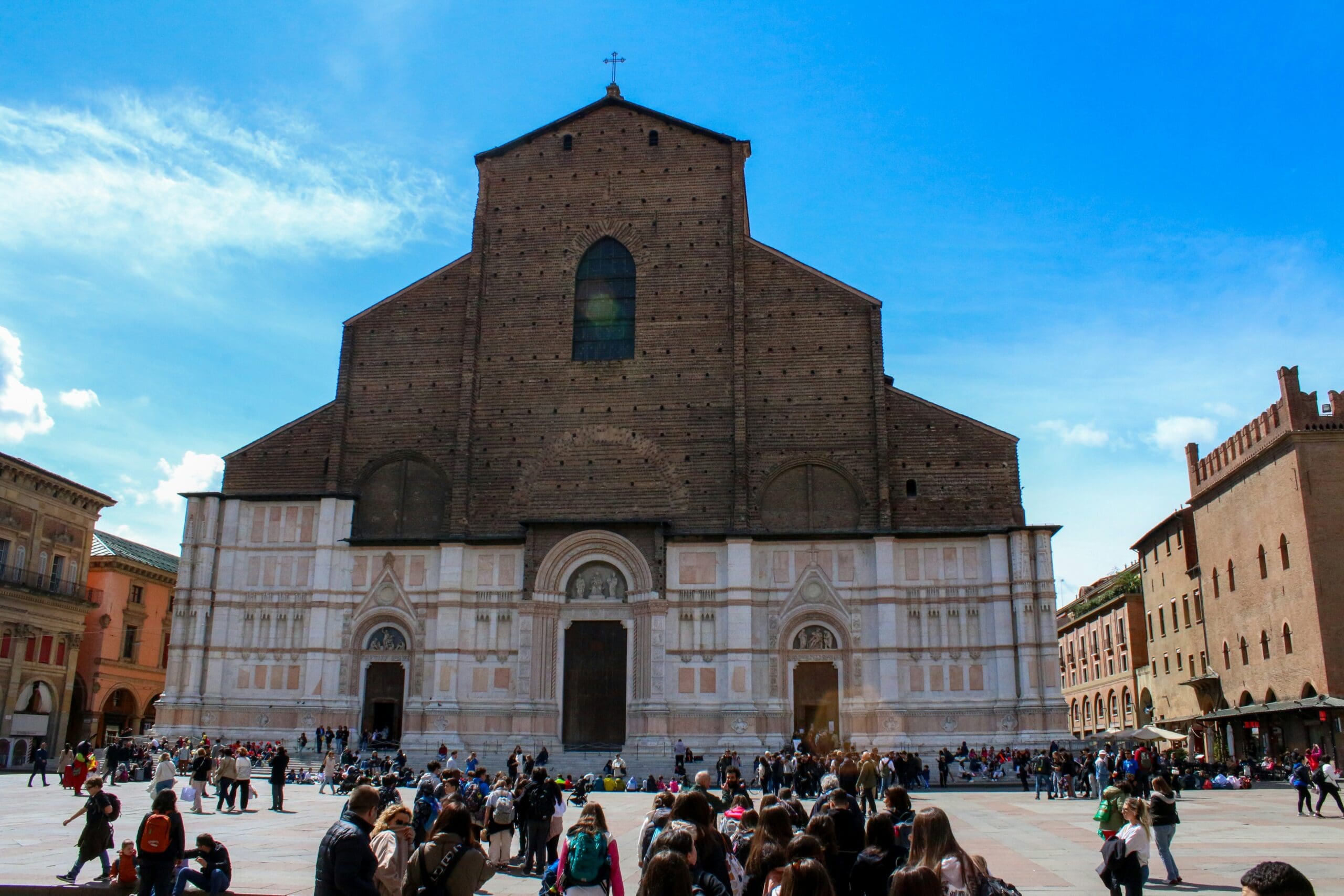 Happy visitors enjoy local specialties at Piazza Maggiore