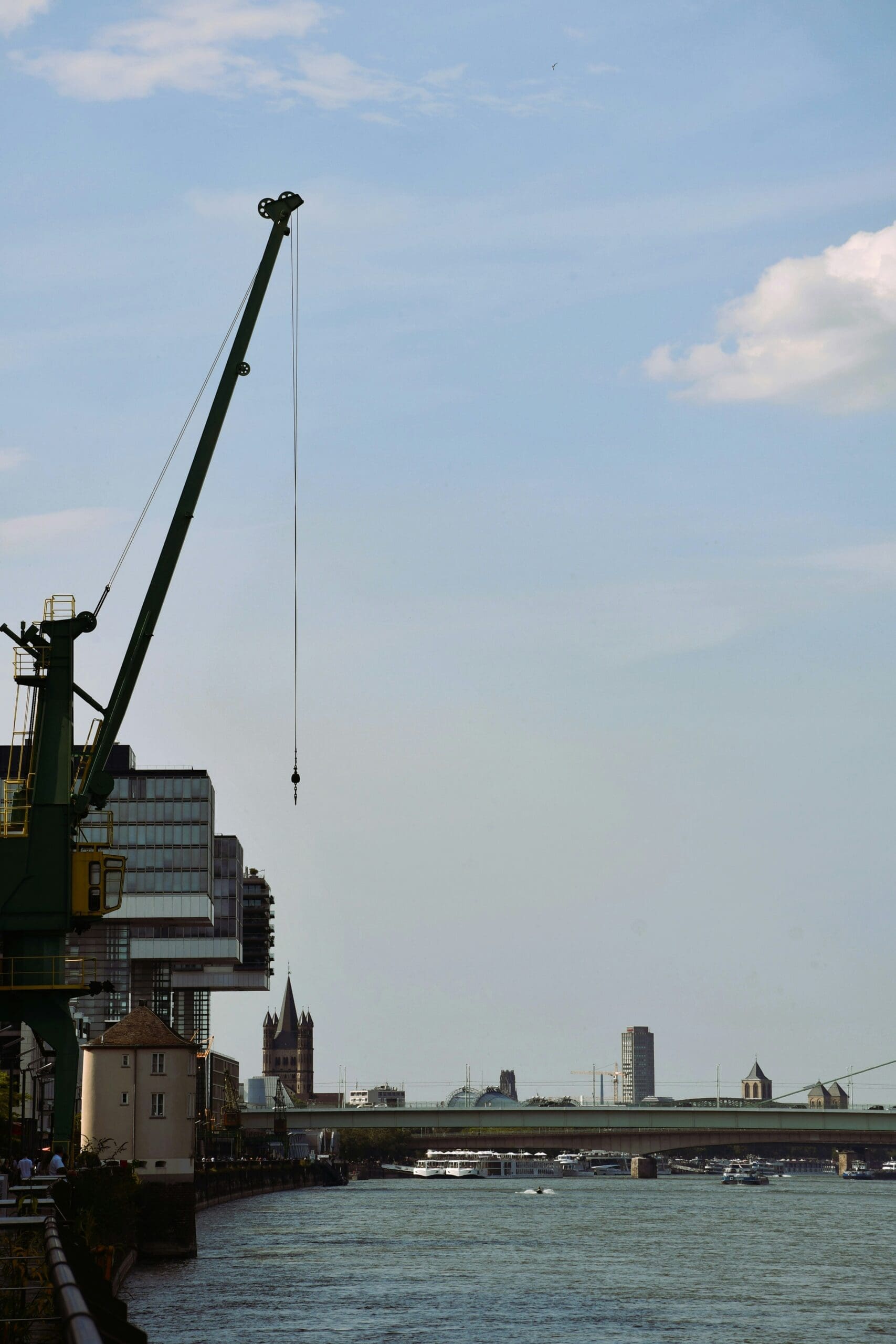 Modern crane houses on the Rheinauhafen in Cologne with reflective water